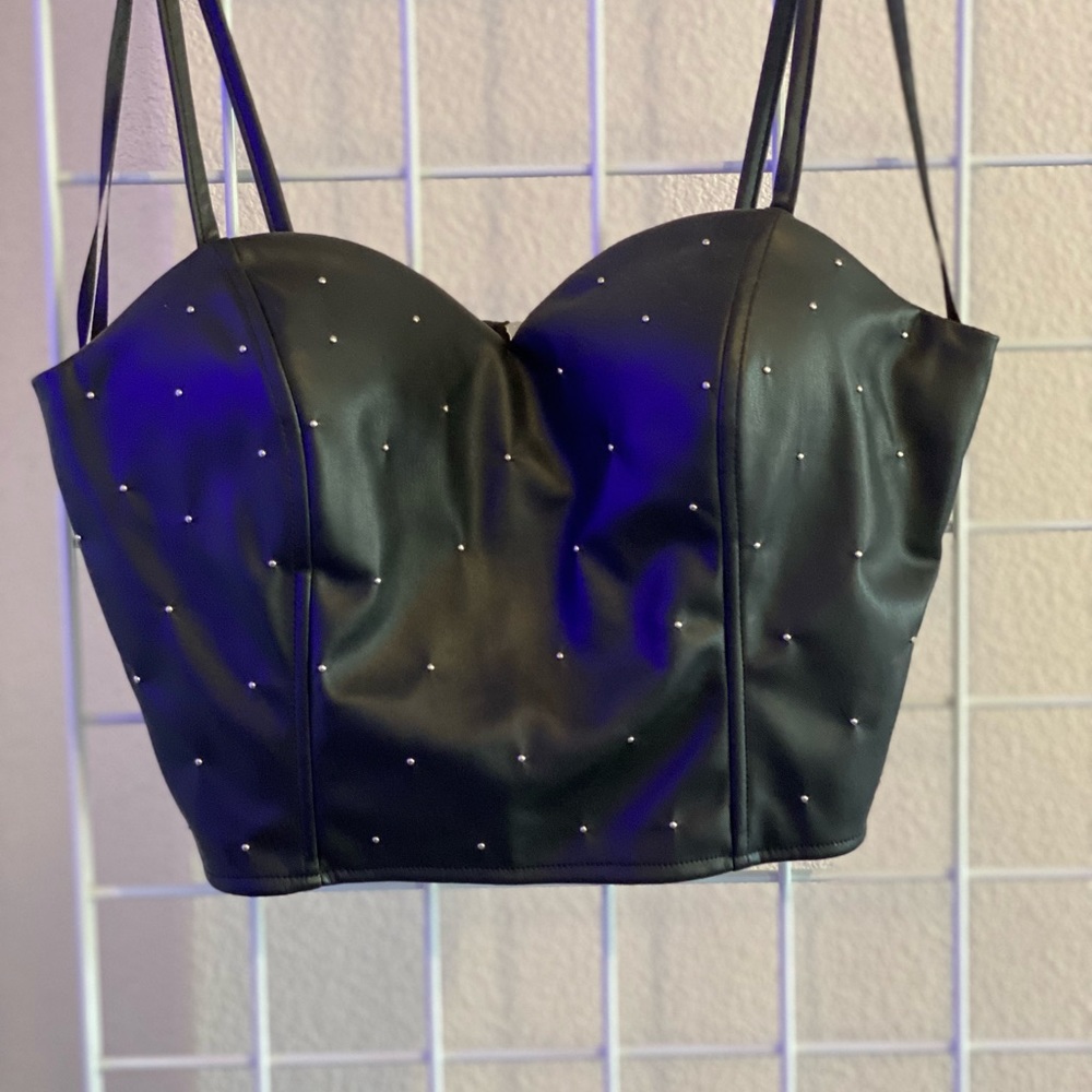 Black leather  top with studs size Large. Cute with a pair of jeans and boots.